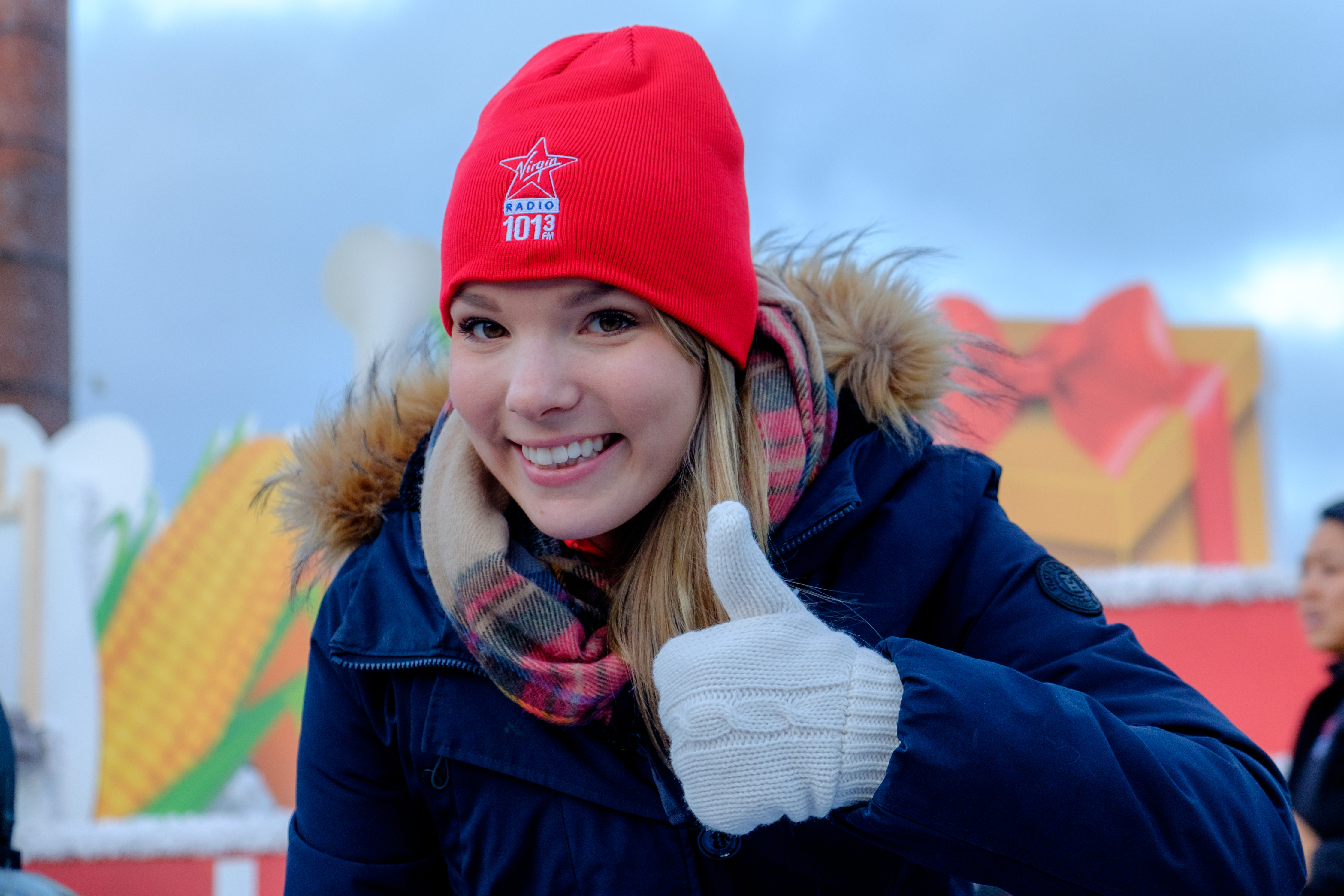 Woman in toque with thumbs up